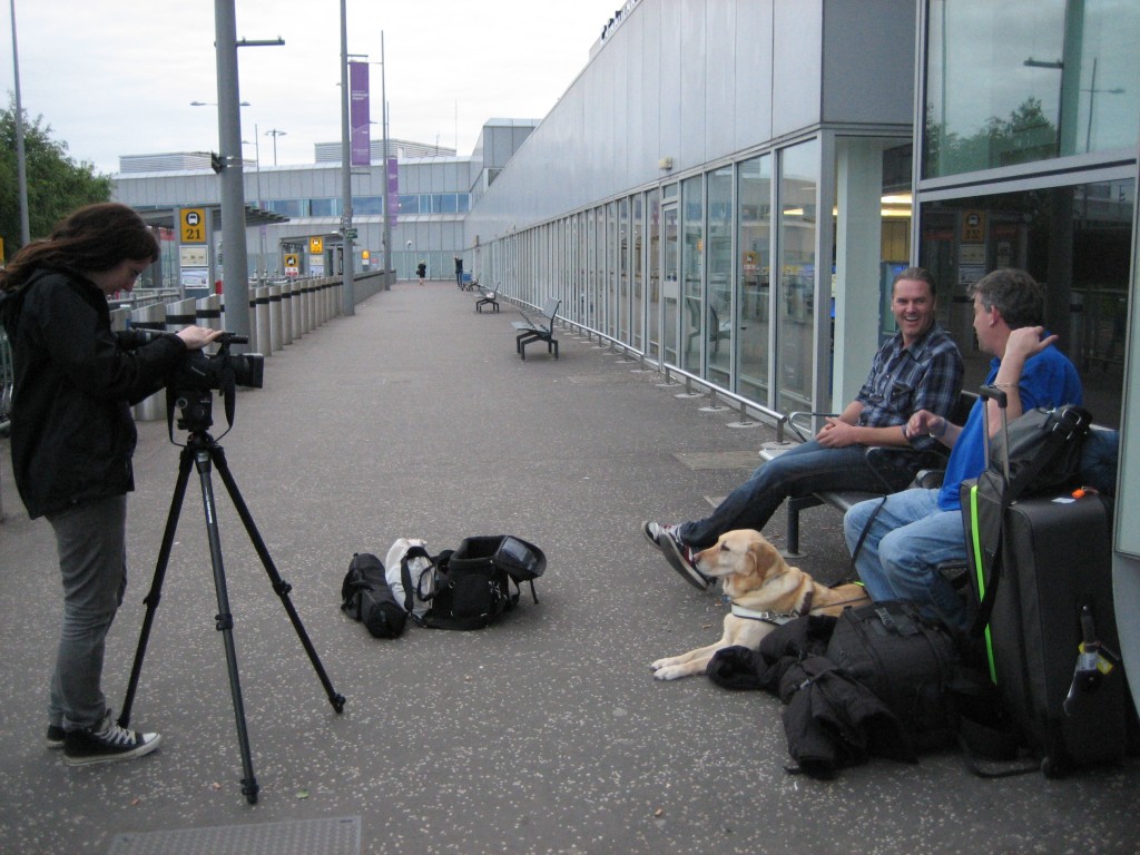 Andrew and Eamon being greeted by Gavin Neate from Guide Dogs, filmed by Morven Williams