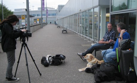 Andrew and Eamon being greeted by Gavin Neate from Guide Dogs, filmed by Morven Williams